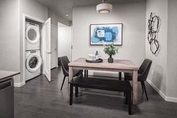 DIning area with view of washer and dryer